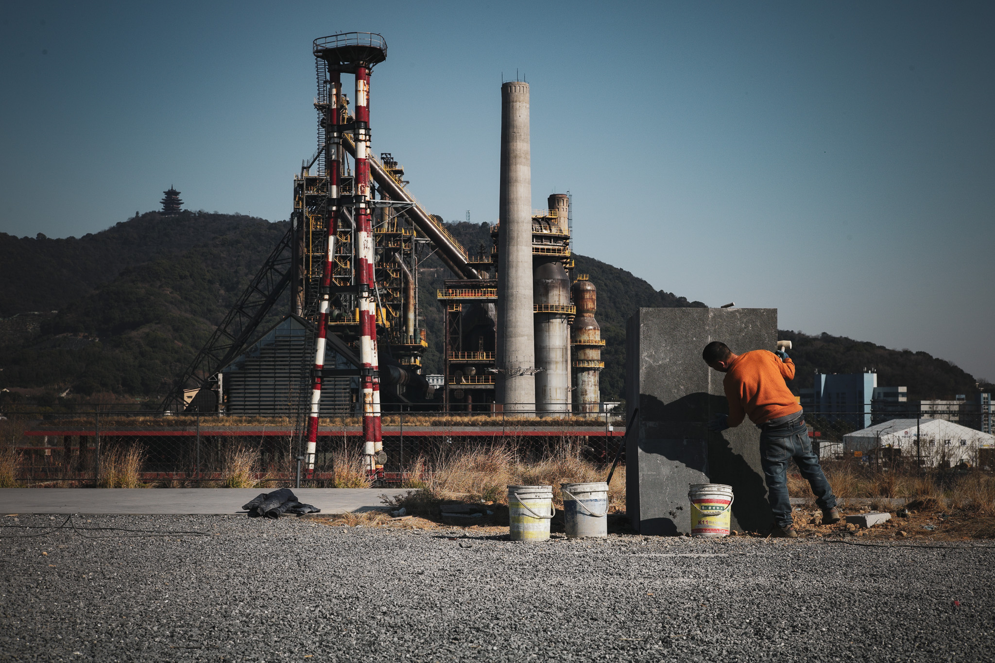 A former steelworks, now a tourist attraction, with a worker small against it